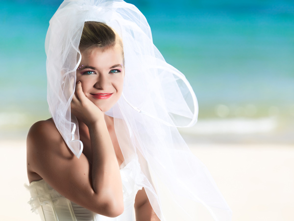 Keep reading to see who sunglasses transform this beach wedding hairstyle