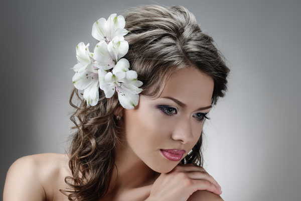 bridal half up hairstyle with flowers. With real flowers, be sure to keep